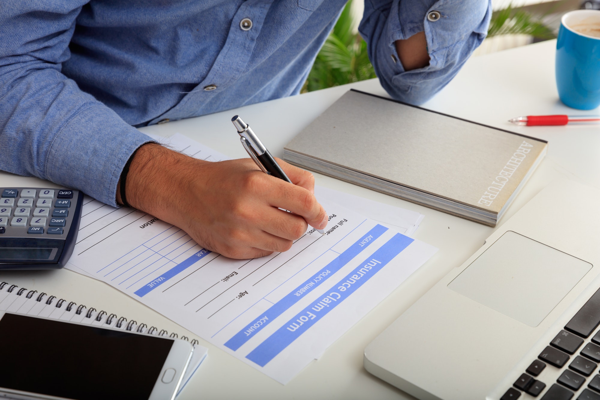 Man preparing an Insurance Claim Form